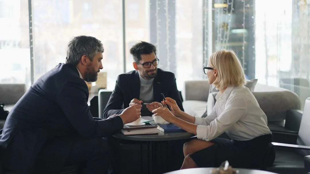 A financial advisor meeting with clients